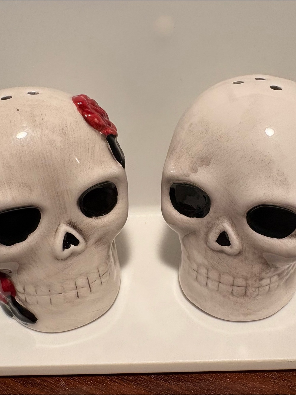 White Ceramic Skull Salt and Pepper Shaker Set with Red Accent